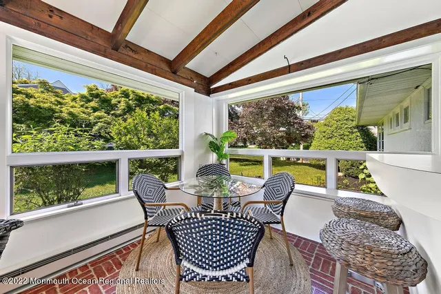 a view of a chair and table in the balcony