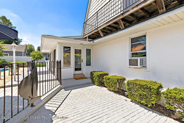 a view of a house with sitting area and furniture