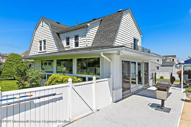 a view of swimming pool with outdoor seating and plants