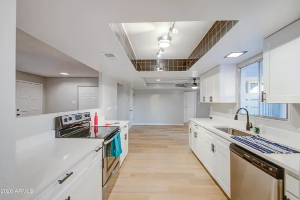 a kitchen that has a lot of cabinets in it