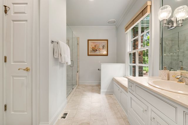 a living room with furniture and a book shelf
