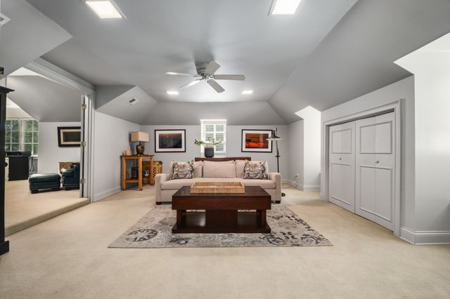a living room with furniture gym equipment and a flat screen tv