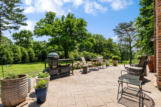 a front view of a house with a garden and porch