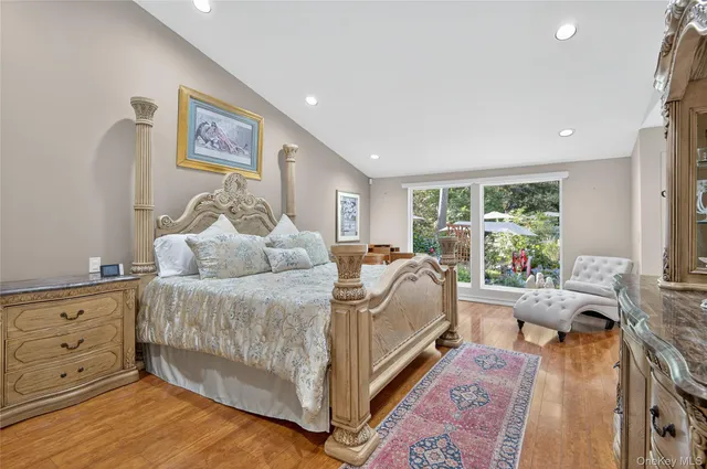 a bed room with a bed and a large window