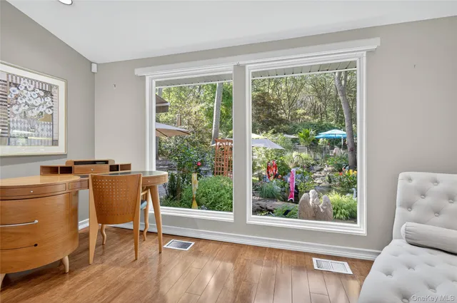 a view of a livingroom with furniture and a window