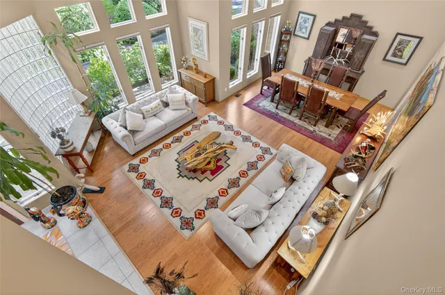 a view of living room with furniture and floor to ceiling windows