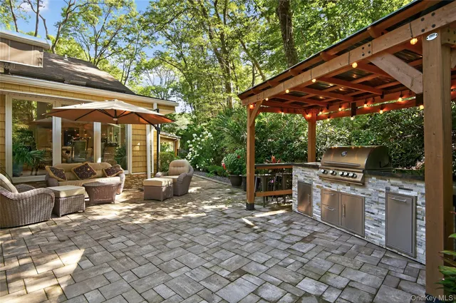 a patio with a yard table and chairs