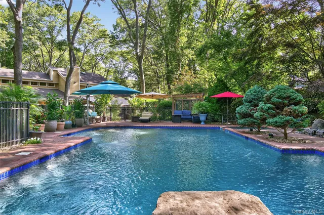 a view of a backyard with a patio and plants