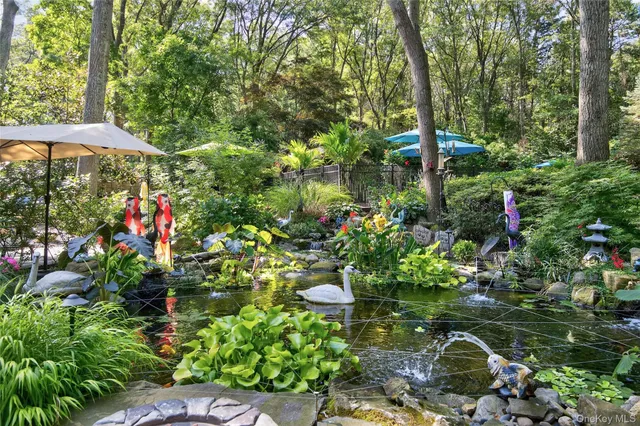 a backyard of a house with lots of green space and garden