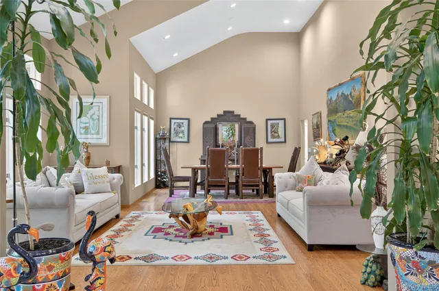 a living room with furniture or couch and a potted plant