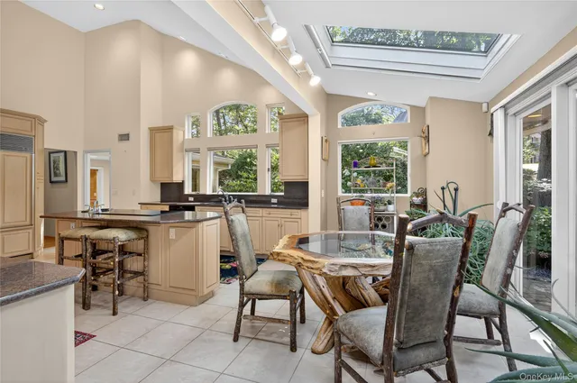 a view of a dining room with furniture window and outside view