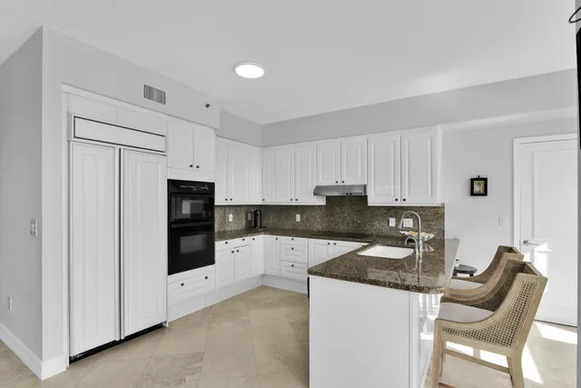 a spacious bedroom with a large bed and a window