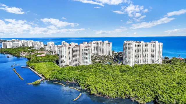 a dining room with furniture a chandelier and window