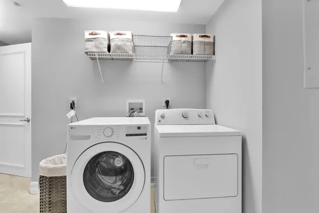 a living room with patio furniture and a potted plant