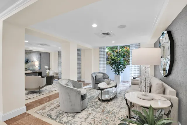 a view of a patio with a table chairs and wooden floor