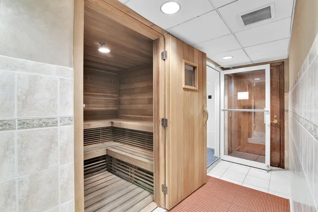 a balcony with wooden floor and city view