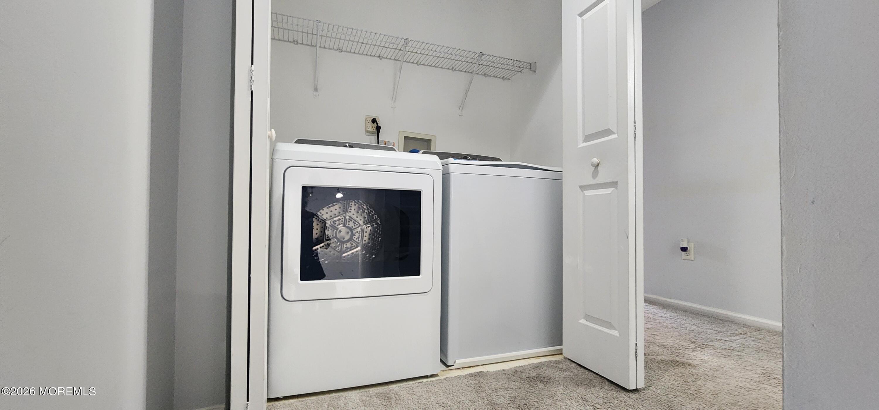 117 Mid Ocean Court, Unit 1000 Howell, NJ 07731 - Photo 11 of 24 a view of hallway with washer and dryer