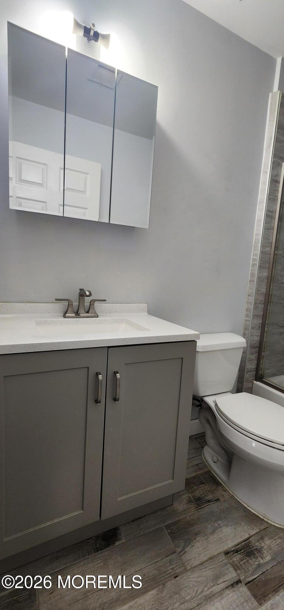 117 Mid Ocean Court, Unit 1000 Howell, NJ 07731 - Photo 14 of 24 a bathroom with a sink a toilet and vanity