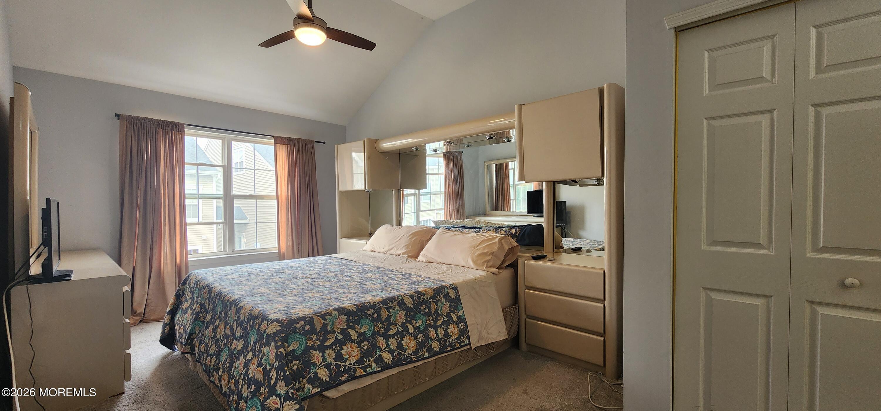 117 Mid Ocean Court, Unit 1000 Howell, NJ 07731 - Photo 15 of 24 a bedroom with a bed next to a window with a dresser