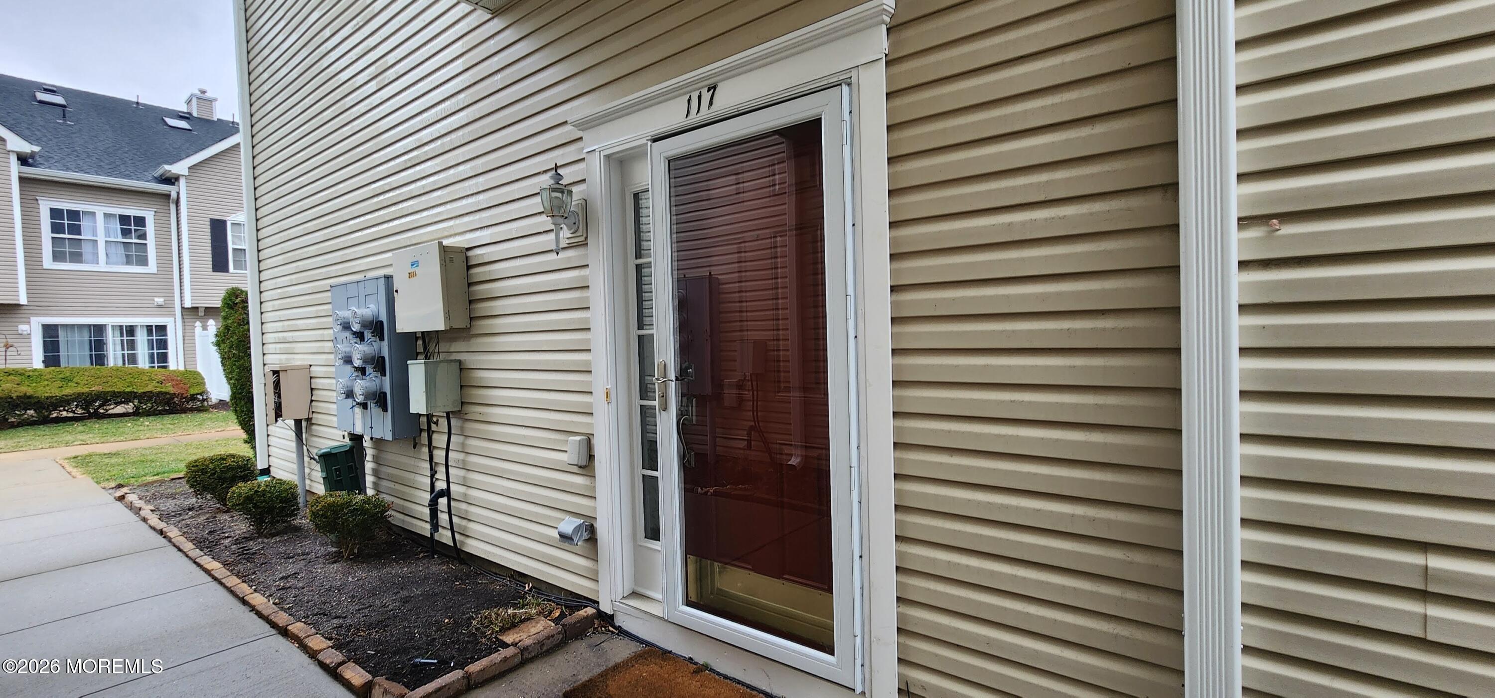 117 Mid Ocean Court, Unit 1000 Howell, NJ 07731 - Photo 2 of 24 a view of a back side of a house