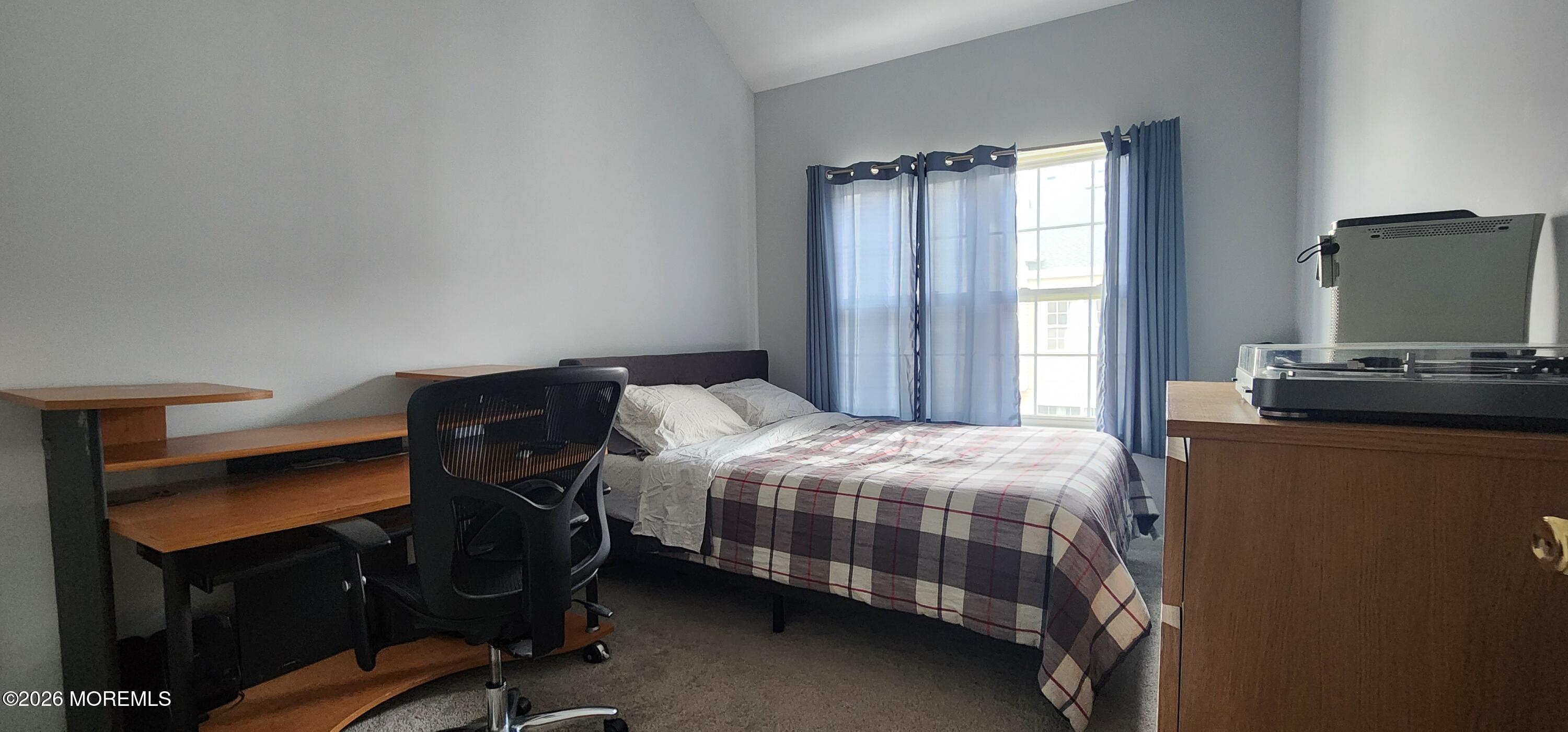 117 Mid Ocean Court, Unit 1000 Howell, NJ 07731 - Photo 21 of 24 a bedroom with a bed and a flat screen tv