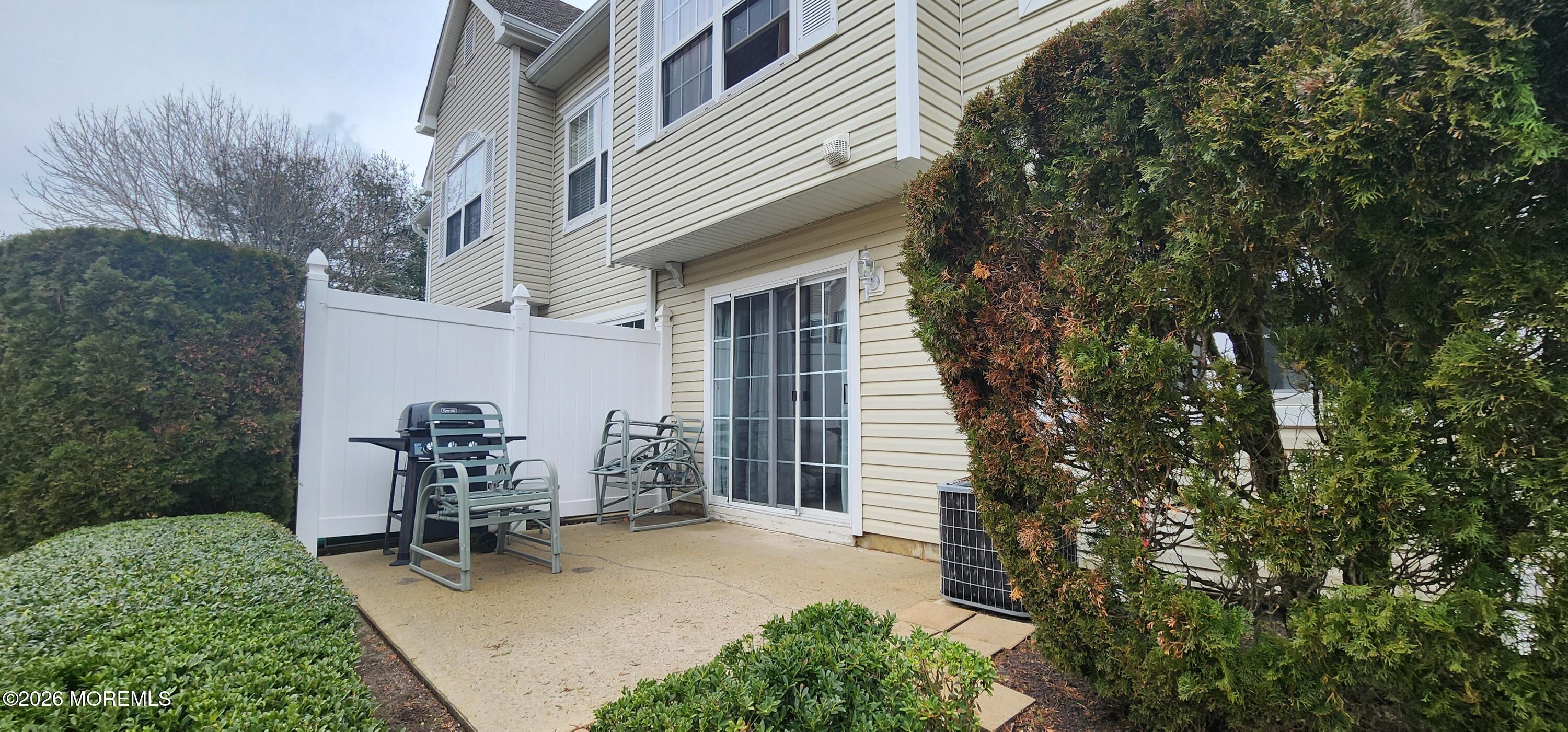 117 Mid Ocean Court, Unit 1000 Howell, NJ 07731 - Photo 23 of 24 a view of a house with backyard and sitting area