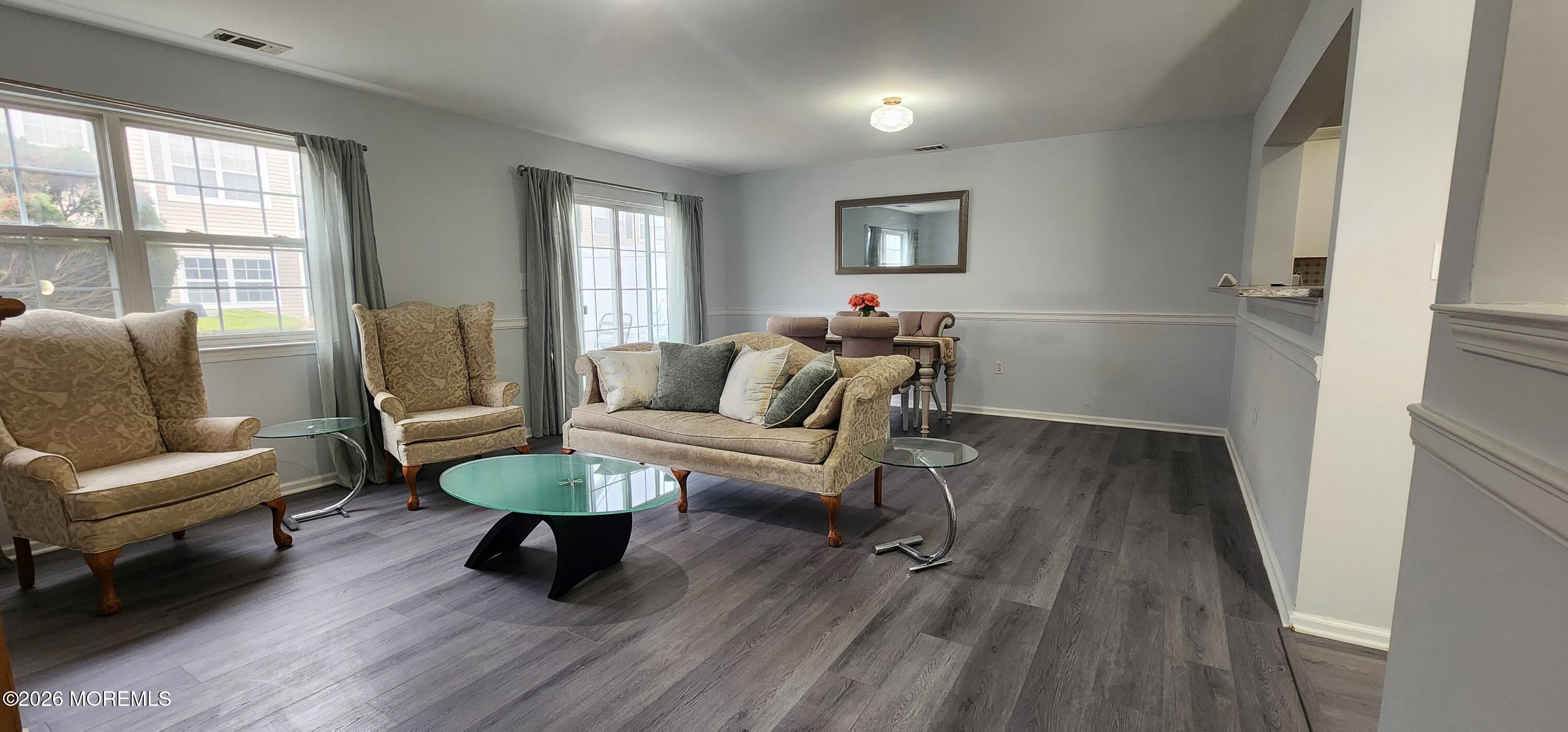 117 Mid Ocean Court, Unit 1000 Howell, NJ 07731 - Photo 3 of 24 a living room with furniture and a wooden floor