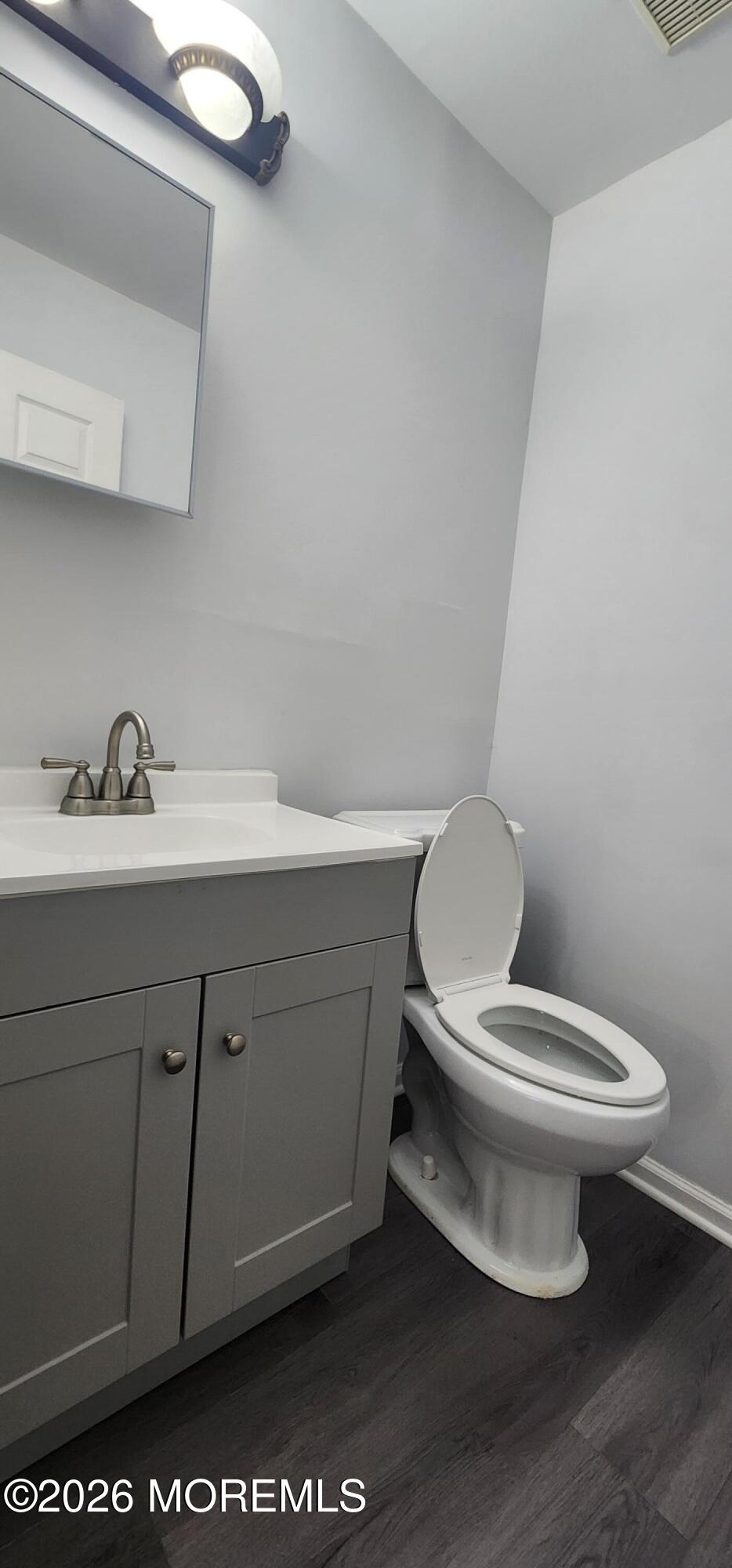 117 Mid Ocean Court, Unit 1000 Howell, NJ 07731 - Photo 10 of 24 a white toilet sitting next to a bathroom sink