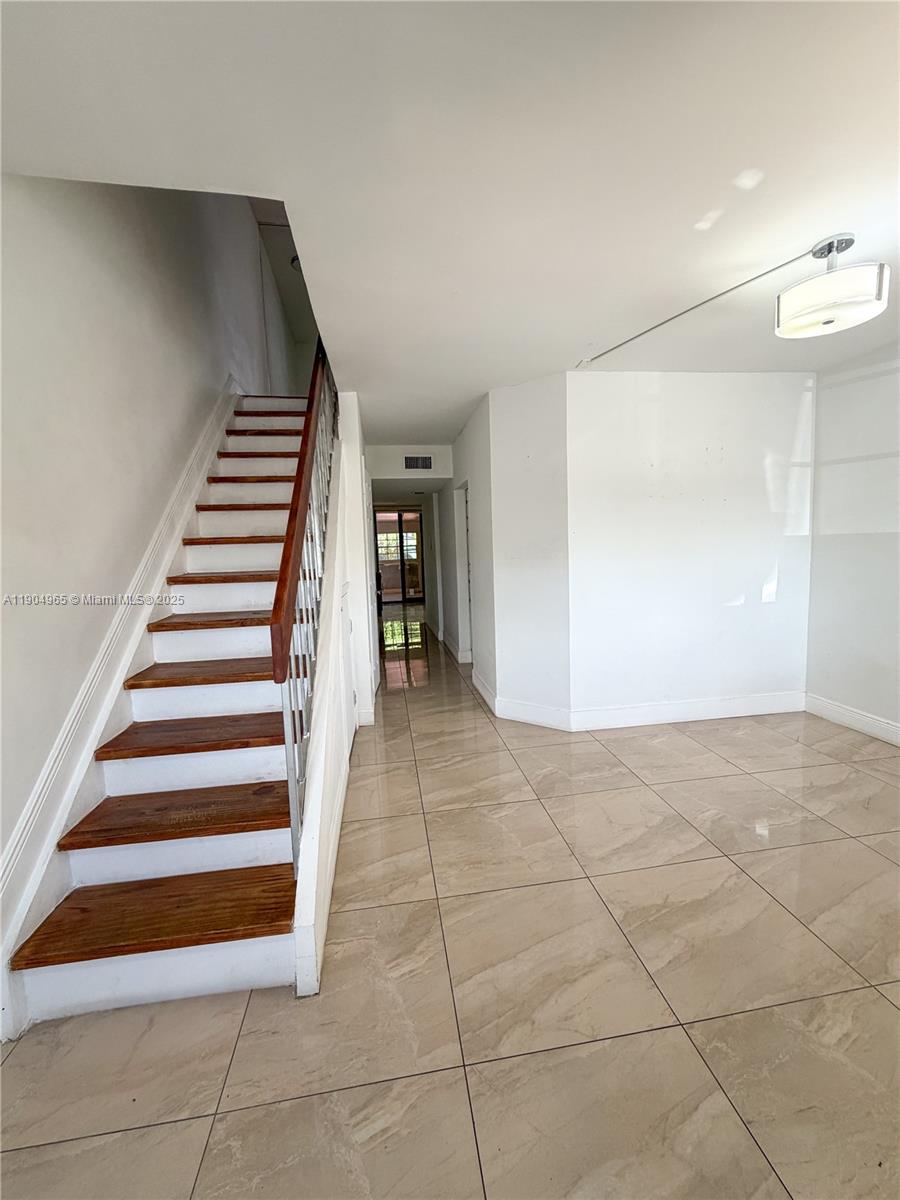 1790 Southwest 122nd Place, Unit 102X Miami, FL 33175 - Photo 5 of 12 a view of entryway and hall