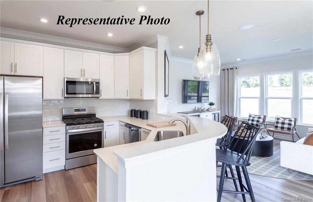 725 Elders Story Road, Unit 347 Fort Mill, SC 29708 - Photo 4 of 18 a kitchen with sink cabinets and stainless steel appliances
