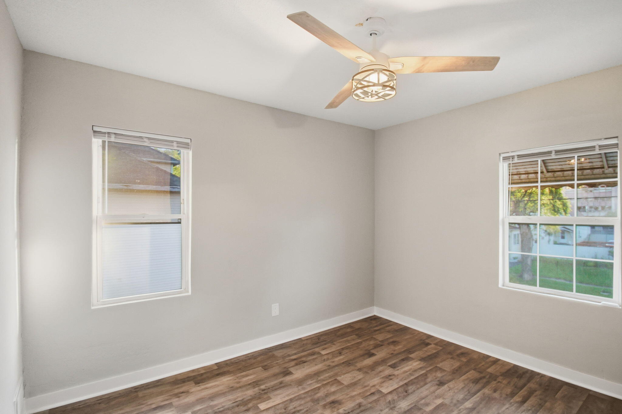 537 Harrison Street Gary, IN 46402 - Photo 12 of 24 a view of an empty room with a window and wooden floor