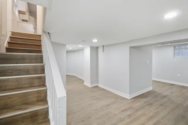 a view of an entryway with wooden floor