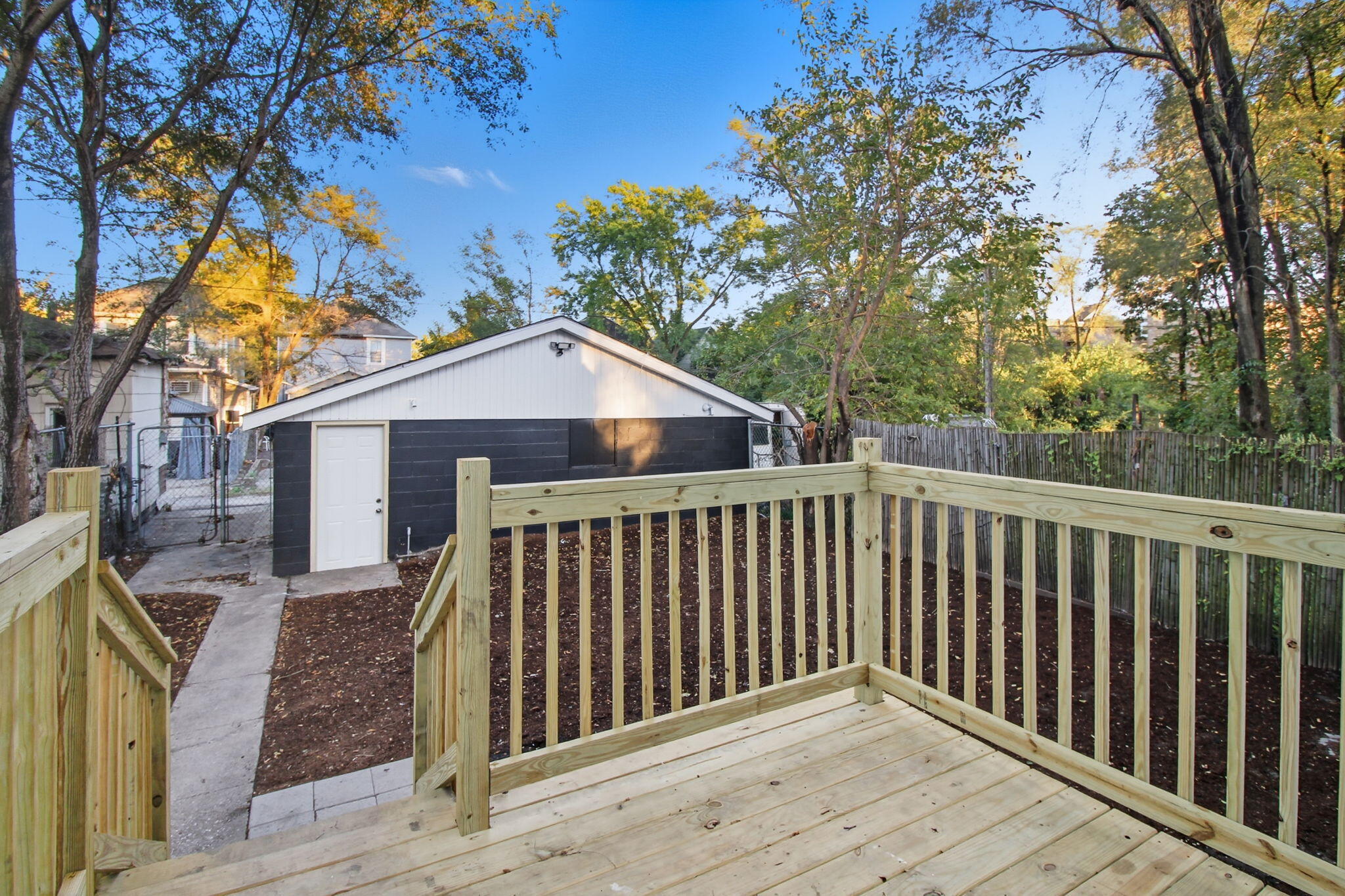 537 Harrison Street Gary, IN 46402 - Photo 22 of 24 a view of a wooden house and a yard