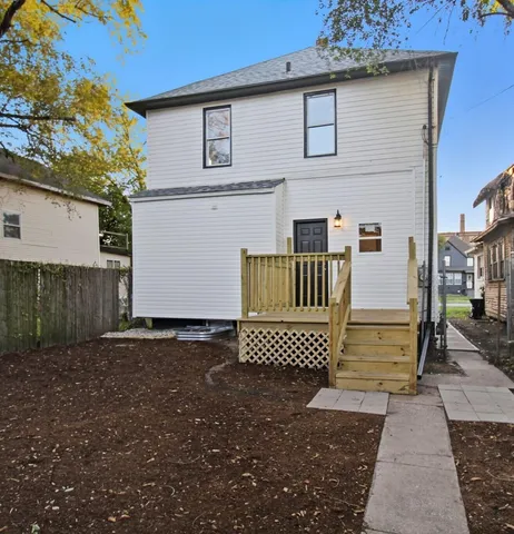 a view of back yard of a house