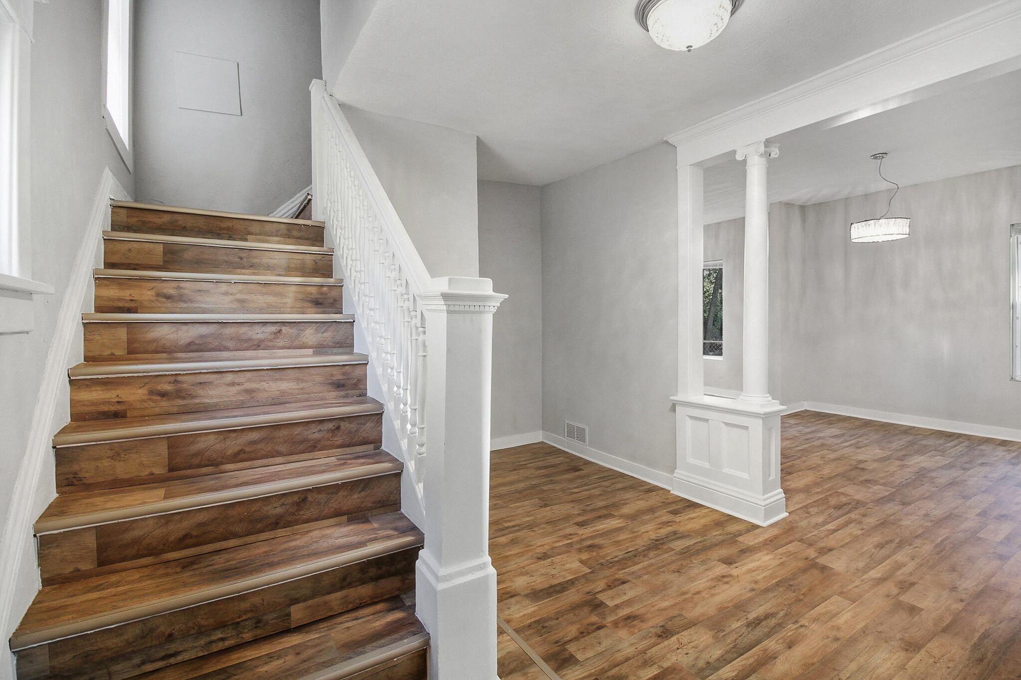 537 Harrison Street Gary, IN 46402 - Photo 3 of 24 a view of entryway and hall with wooden floor