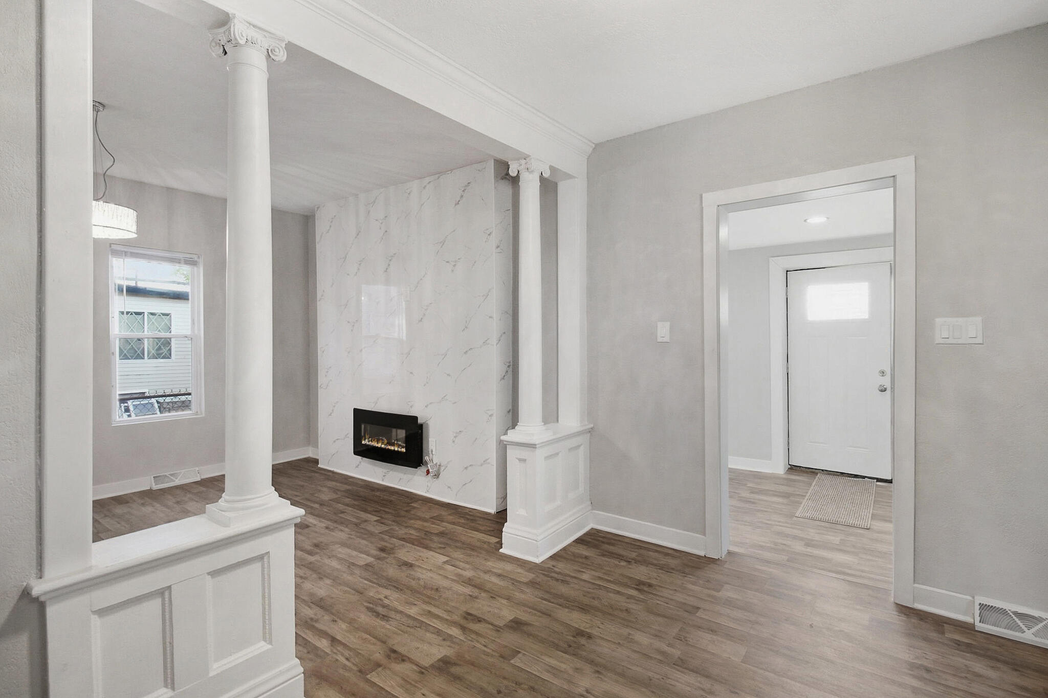 537 Harrison Street Gary, IN 46402 - Photo 4 of 24 a view of a livingroom with wooden floor and a fireplace