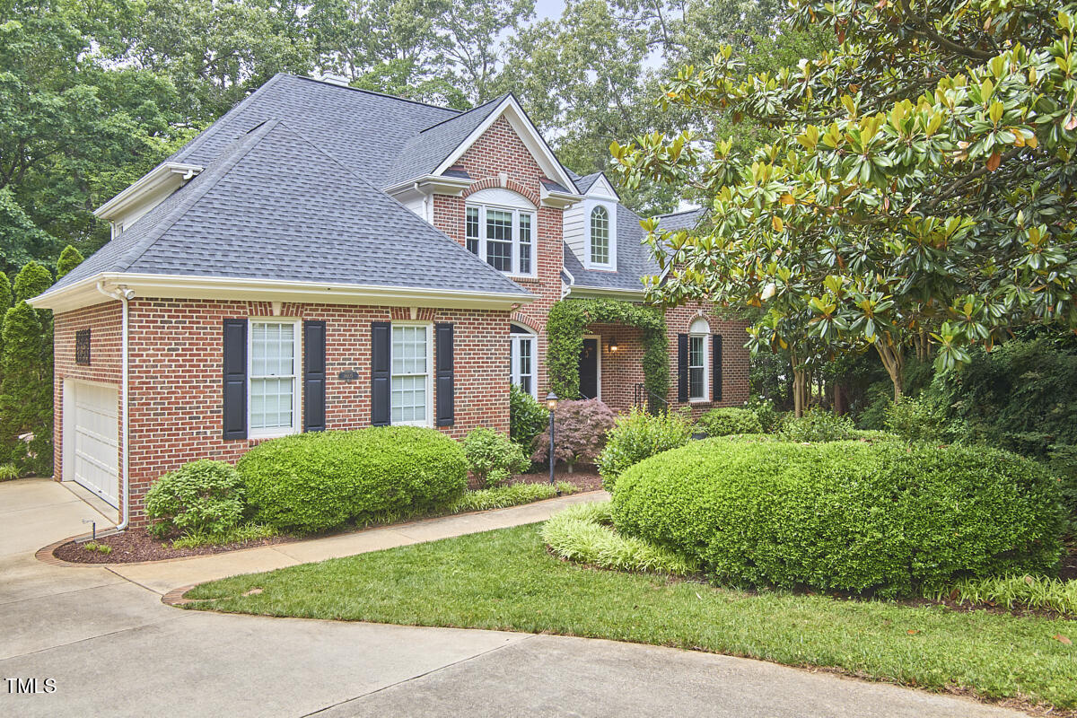 8605 Stanton Place Raleigh, NC 27615 - Photo 1 of 56 a front view of a house with a yard