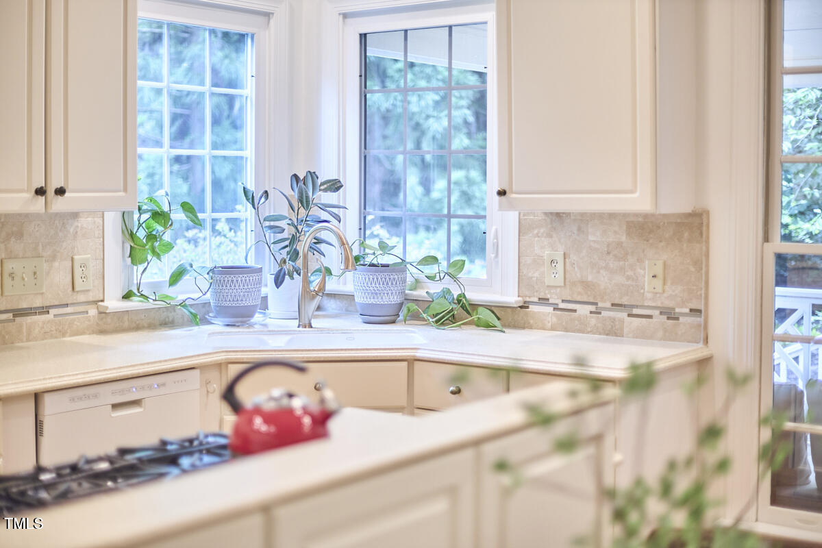 8605 Stanton Place Raleigh, NC 27615 - Photo 19 of 56 a kitchen with a sink and window