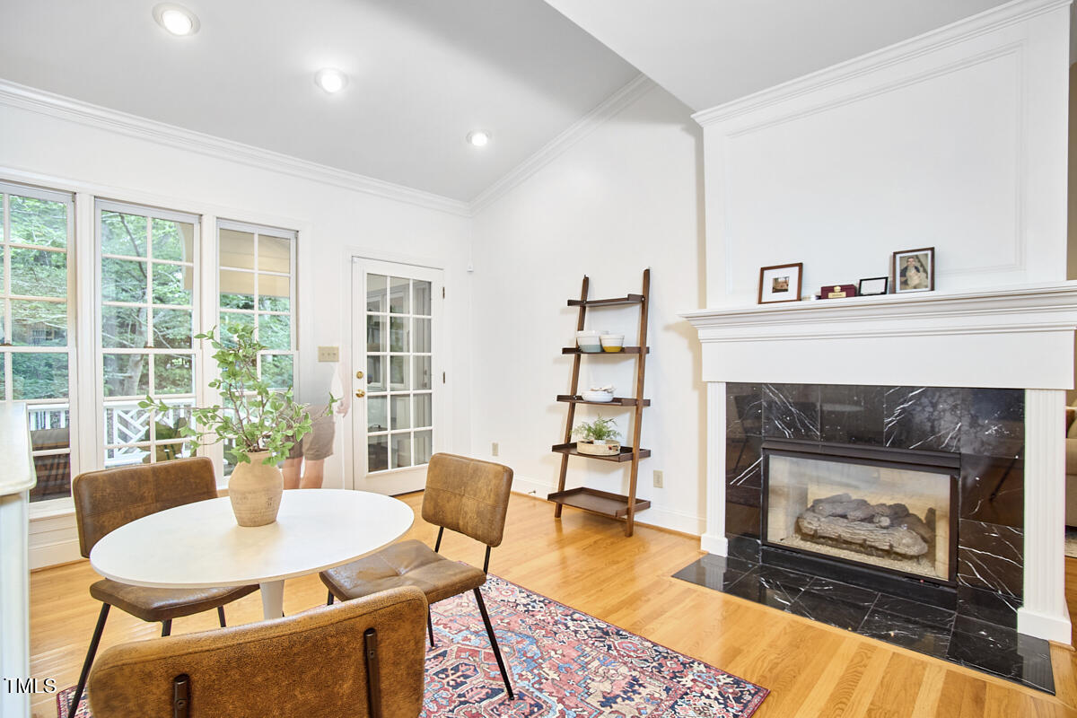 8605 Stanton Place Raleigh, NC 27615 - Photo 21 of 56 a living room with furniture and a fireplace