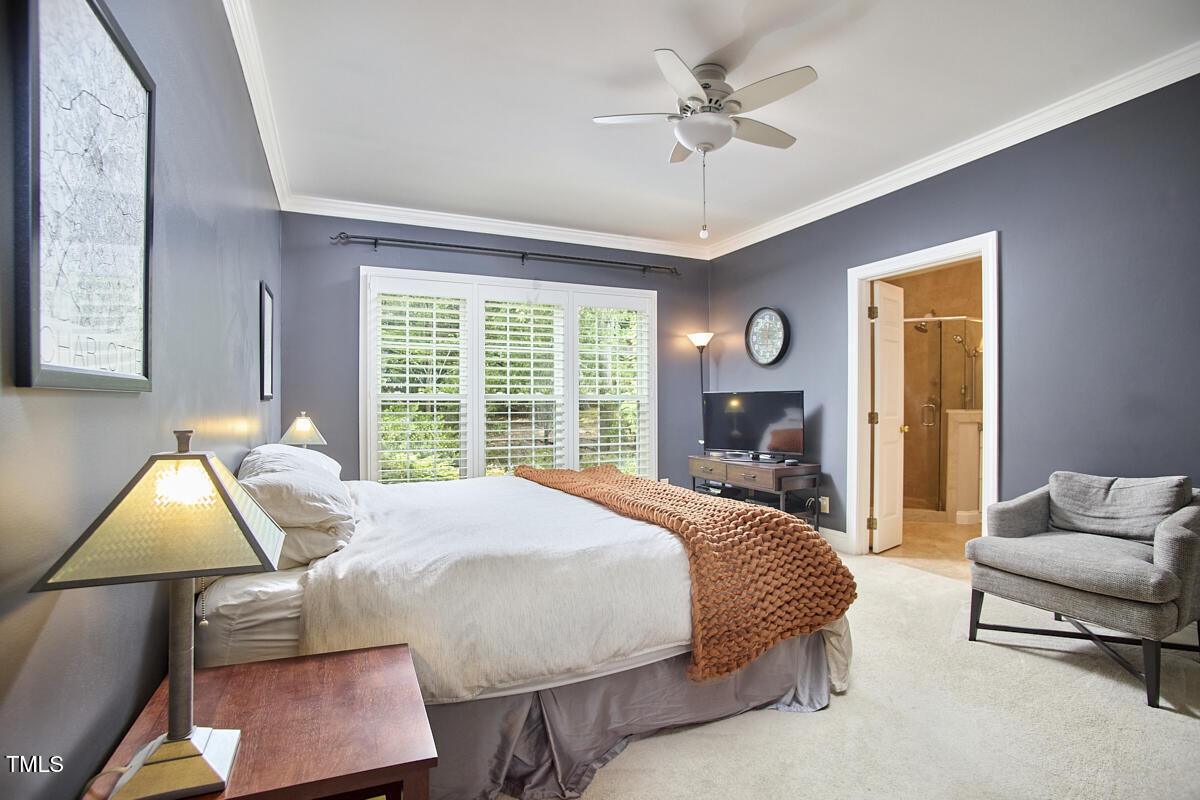 8605 Stanton Place Raleigh, NC 27615 - Photo 32 of 56 a bedroom with a bed and window