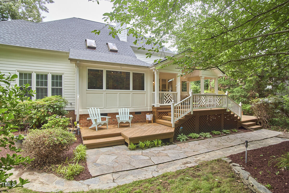 8605 Stanton Place Raleigh, NC 27615 - Photo 46 of 56 a front view of a house with garden