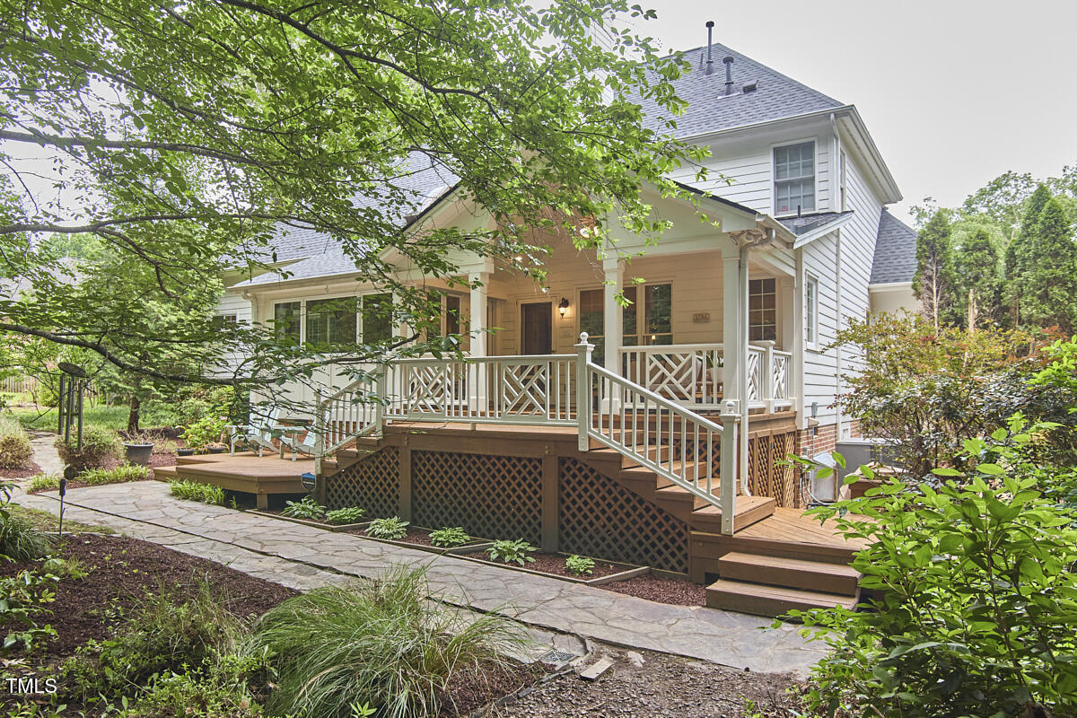 8605 Stanton Place Raleigh, NC 27615 - Photo 50 of 56 a front view of a house with a garden