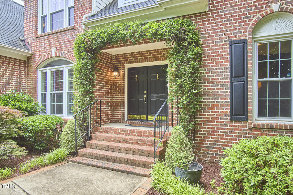 8605 Stanton Place Raleigh, NC 27615 - Photo 5 of 56 a view of a house with potted plants