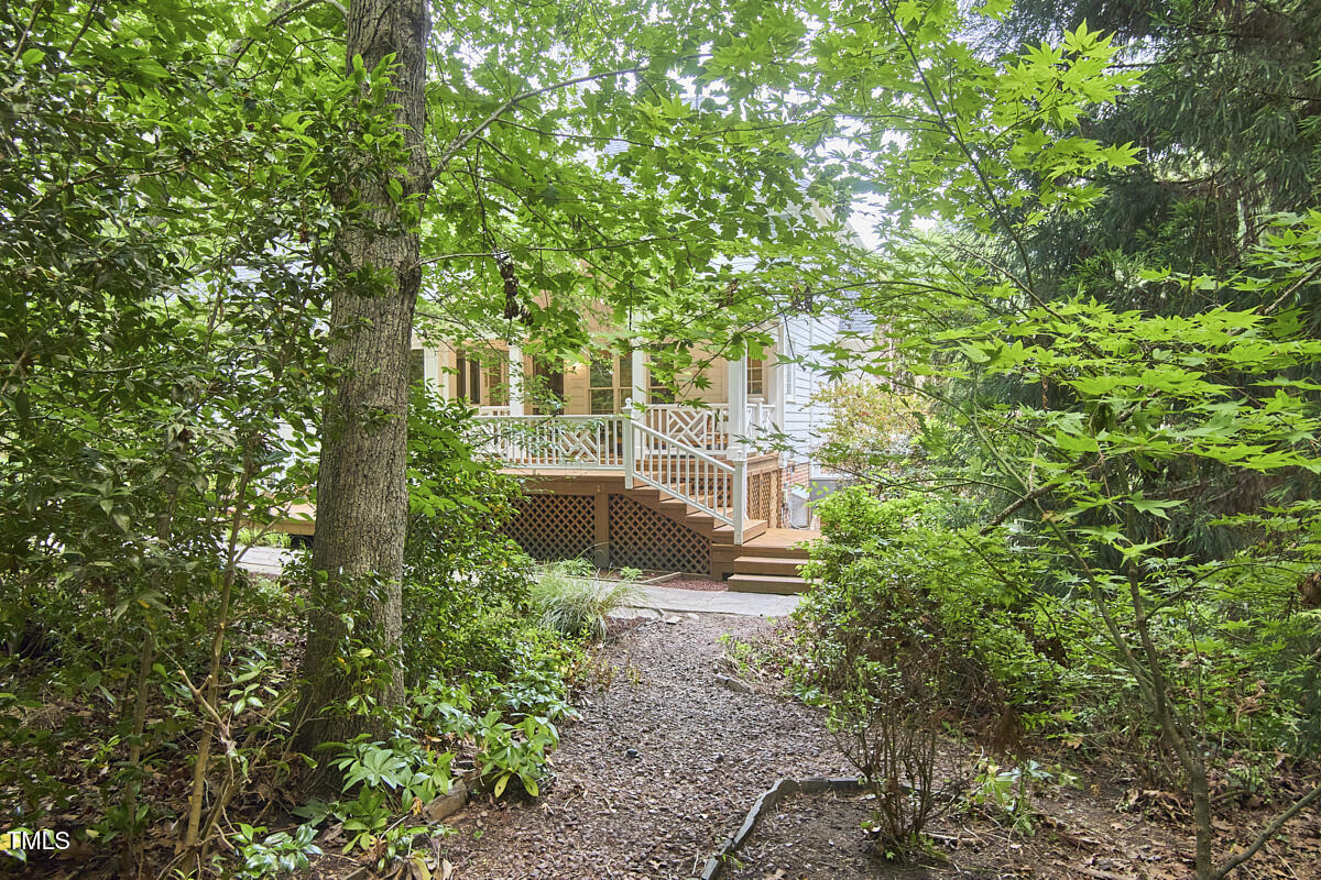 8605 Stanton Place Raleigh, NC 27615 - Photo 55 of 56 a aerial view of a house with yard and large trees