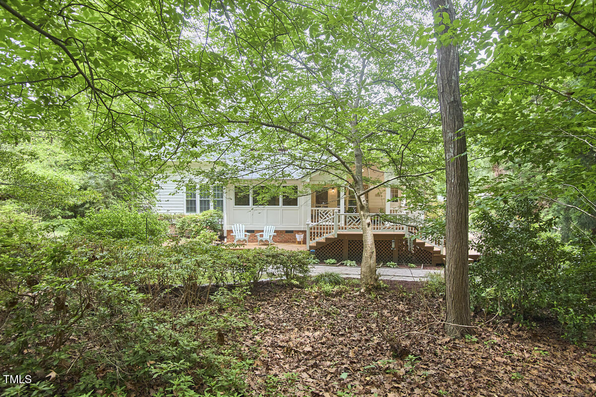 8605 Stanton Place Raleigh, NC 27615 - Photo 56 of 56 a view of a house with backyard sitting area and garden