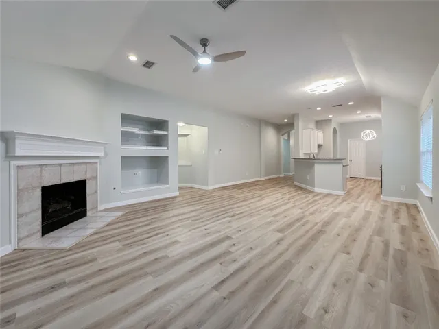 a view of a kitchen with furniture and a fireplace
