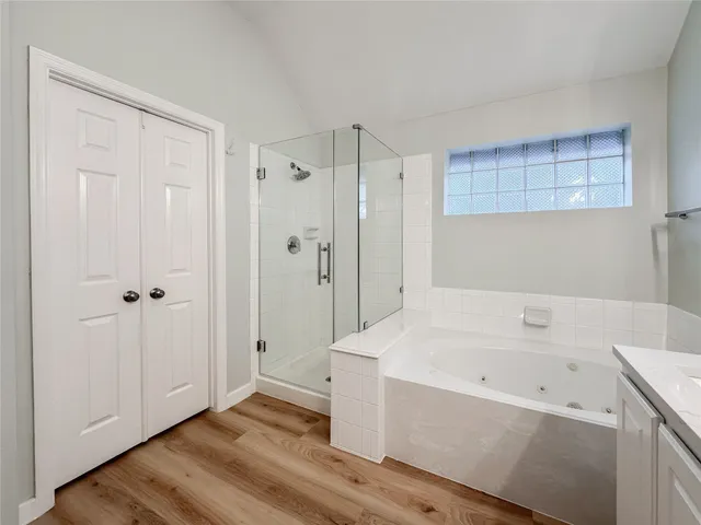 a bathroom with a bathtub and a shower