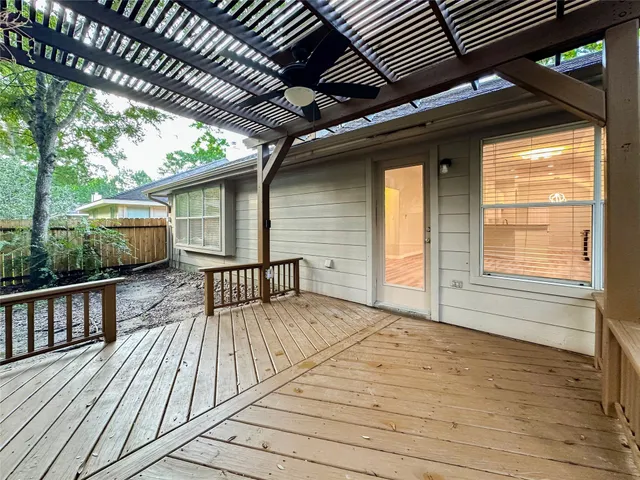 a view of backyard with a deck