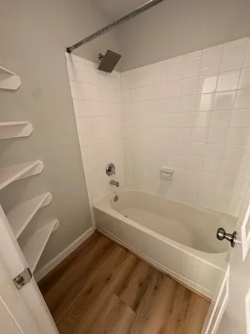 a bathroom with a bathtub and a toilet