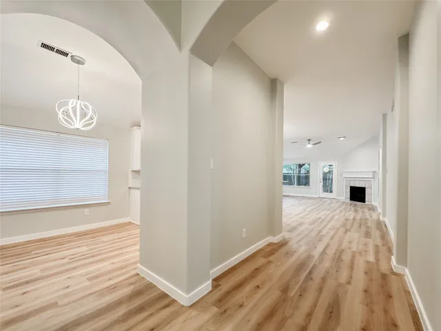 a view of a kitchen from the hallway